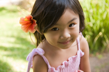 Girl with a Flower at the Pediatric Dentist Office in Newark, Bear and Glasgow, DE